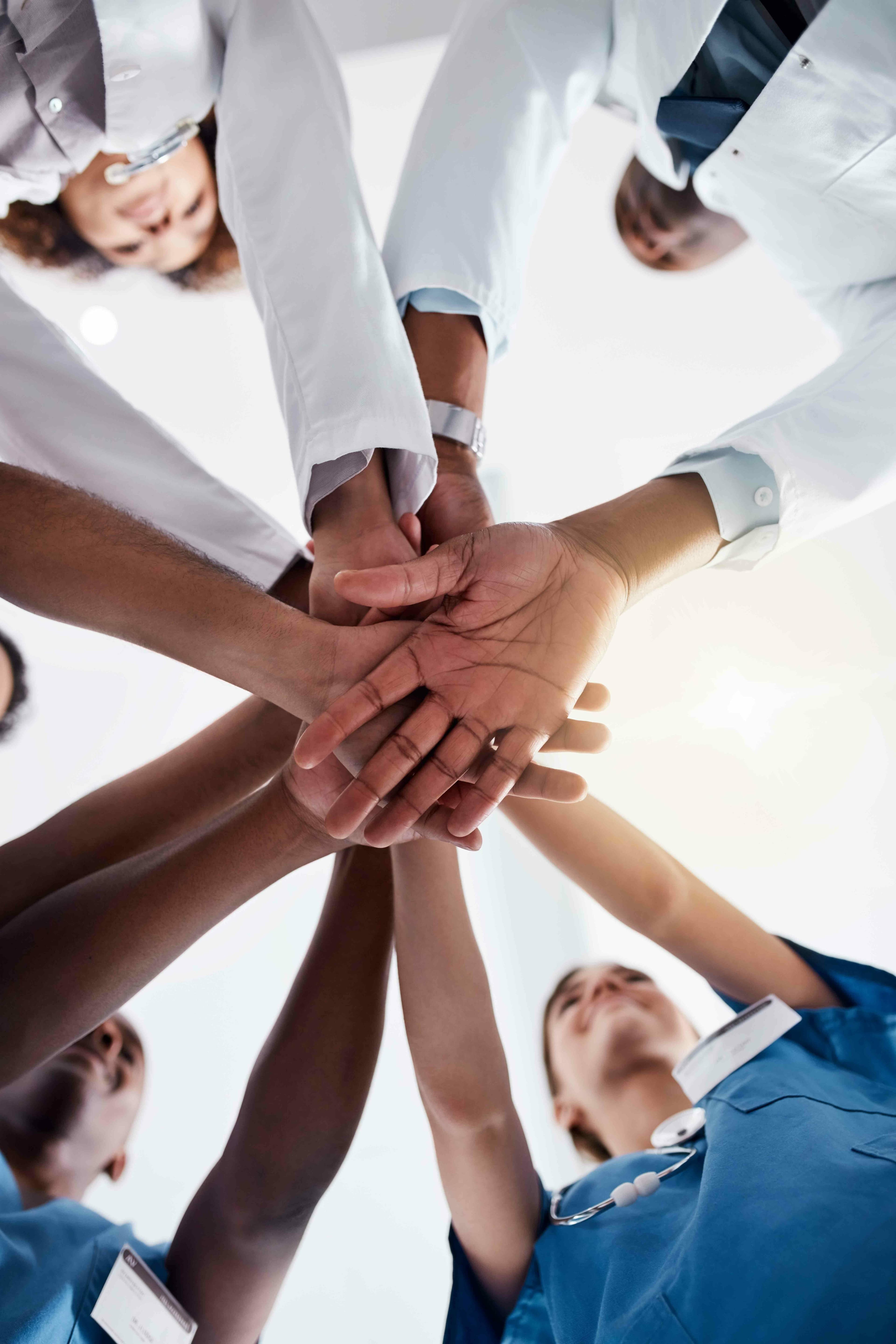 Why Choose Us Medical professionals showing unity and support as a healthcare team
