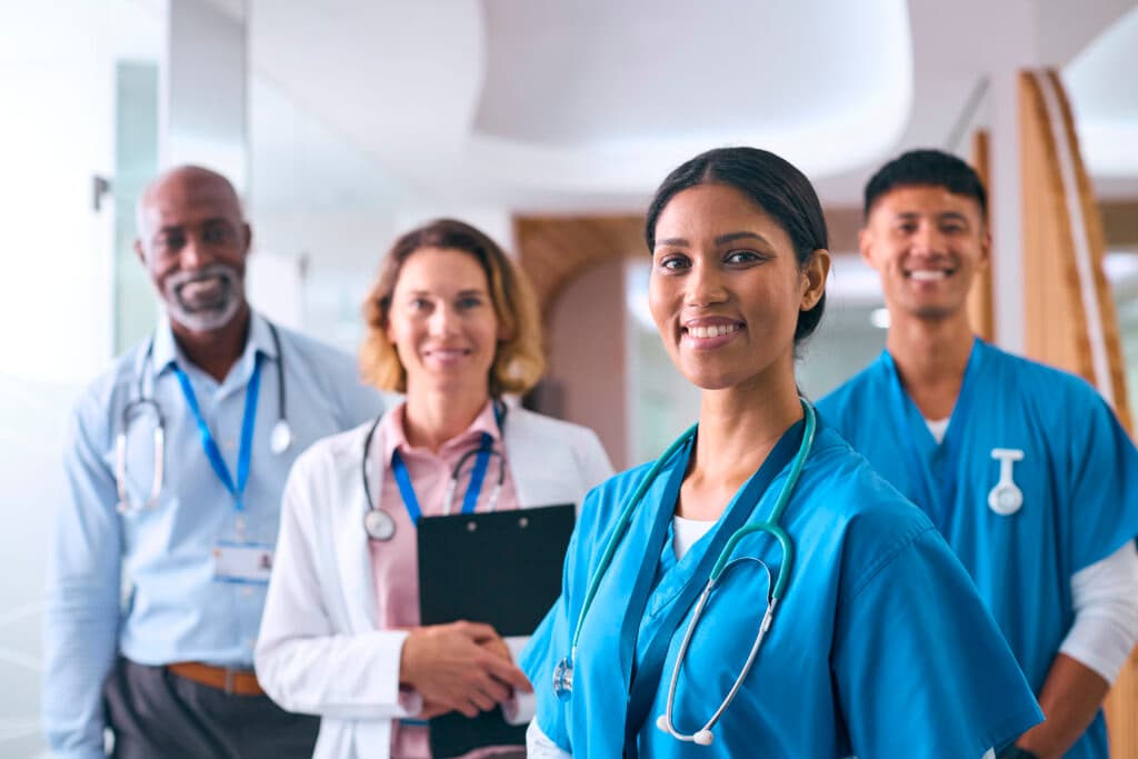 NPD-BC Recertification and Continuing Education Portrait of smiling multi-cultural medical team working together