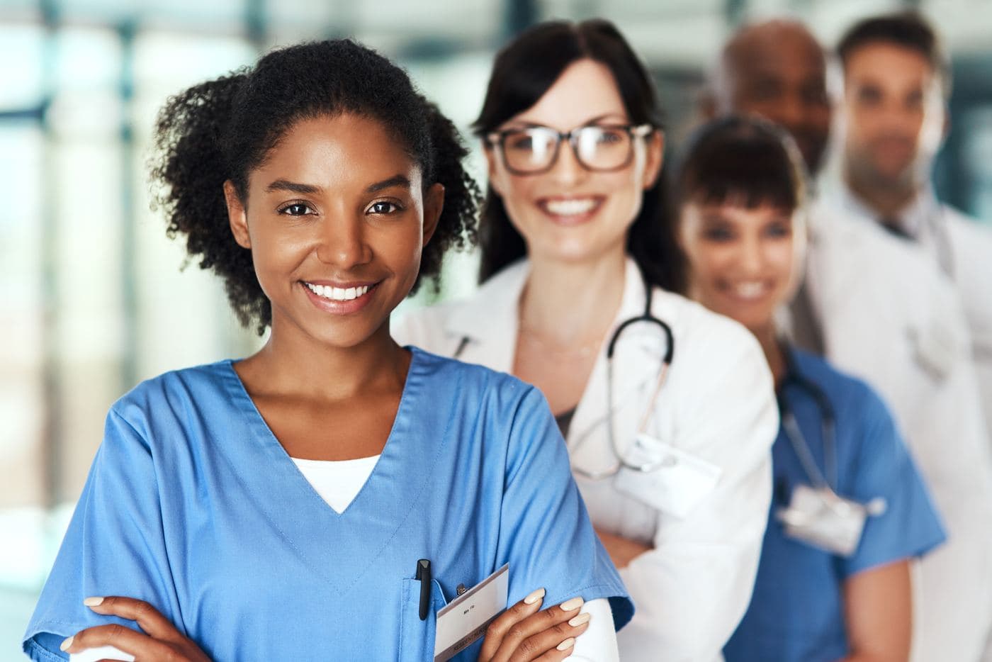 Your Path to NPD-BC Certification Healthcare team standing together in support of nursing professional development